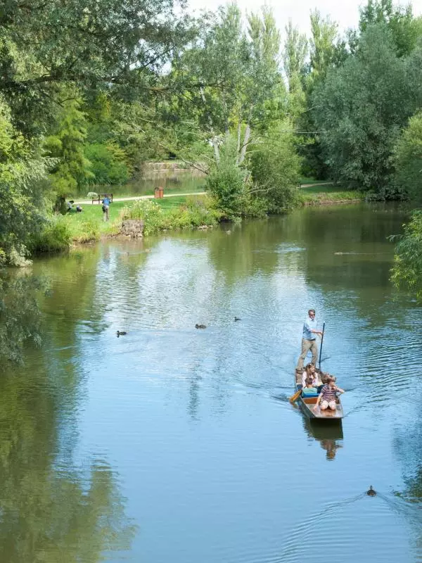 Visitors punting on the river